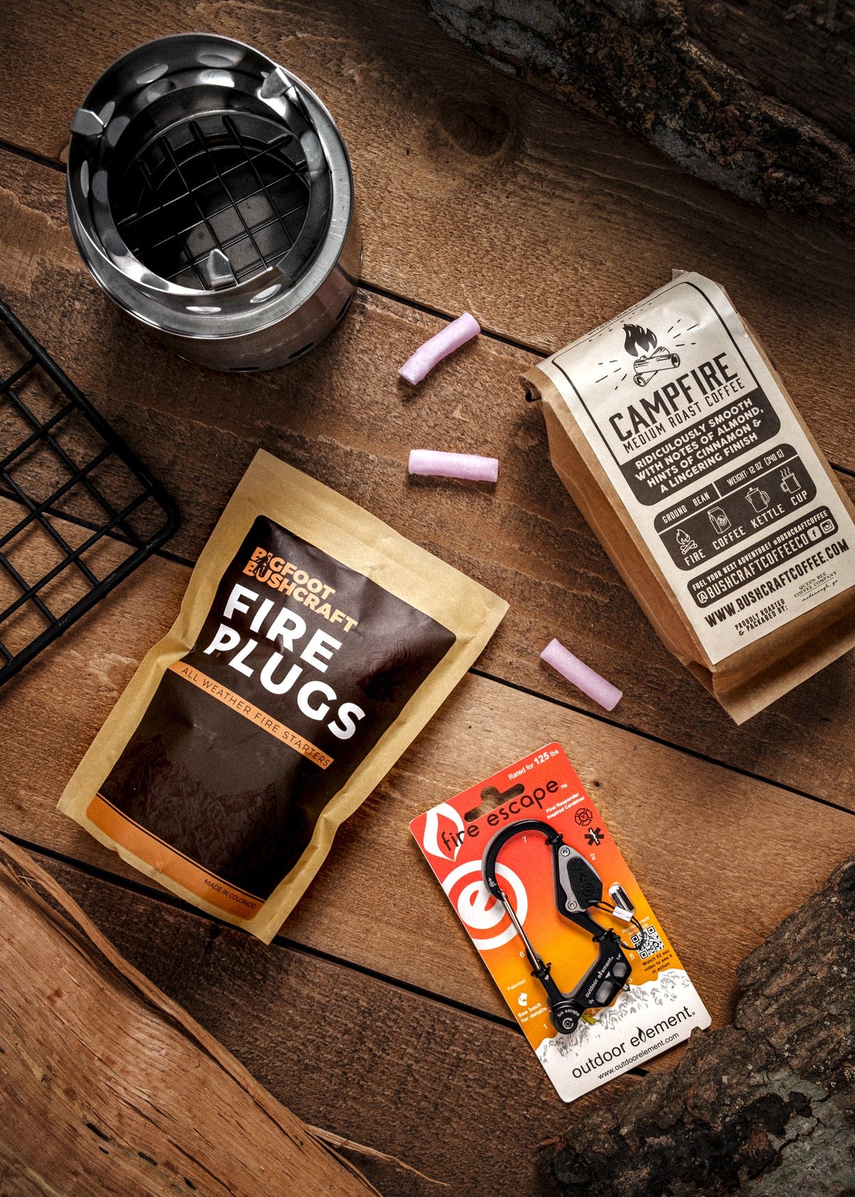 Fire Plugs and a campfire coffee kit laid out on a wood table
